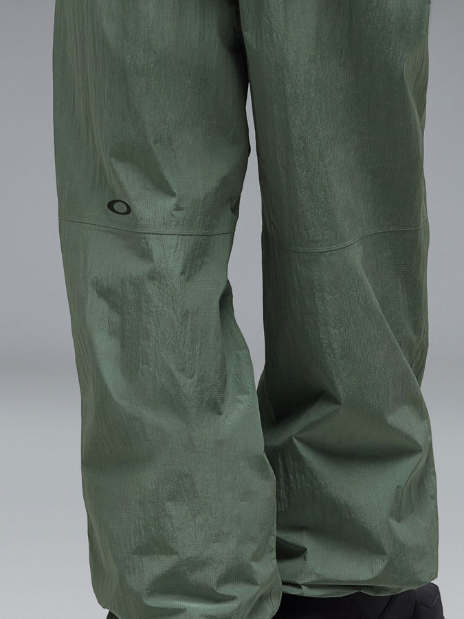 Oakley Channel Glow 2027 – Shell Pants | REFLECTIVE CAMO AV GREEN (7D7)