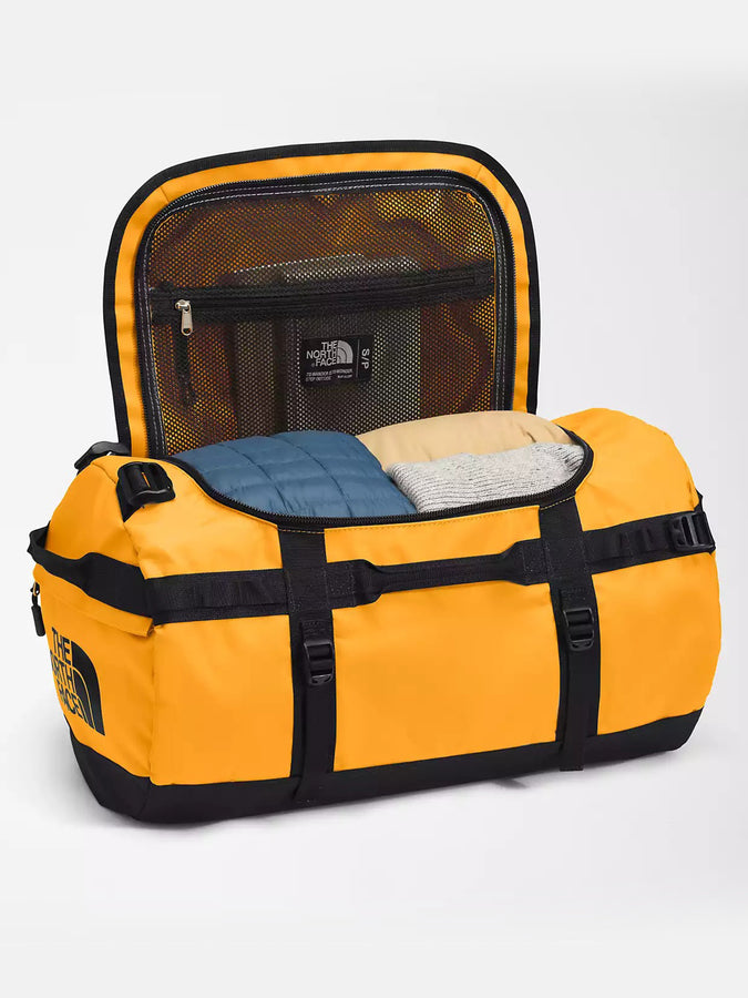 The North Face Base Camp Small Duffle Bag | SUMMIT GOLD/TNF BLK (ZU3)